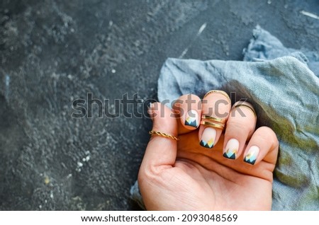 Excellent nails design with geometric pattern. Place for text. dark background.