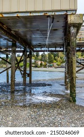 Excess Water Flow Down From Below The  Pier In Redondo Beach, Washington.