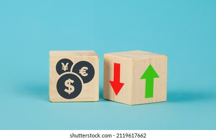Exchange rate wooden cubes. Currency selection concept on wooden cubes with an arrow. Wooden blocks with up and down arrows. The concept of lowering and increasing indices, exchange rates. Dynamics