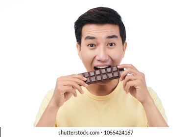 Excite Young Vietnamese Man Eating Chocolate Bar