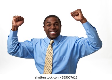 Excited African Business Man With His Arms In The Air Isolated On A White Background.