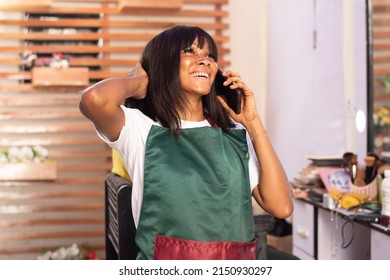 Excited African Makeup Artist Making A Phone Call