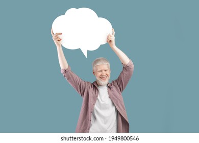 Excited albino gut holding empty speech bubble above his head over turquoise studio background. Handsome man with blank word cloud, mockup for your ad or design, copy space - Powered by Shutterstock