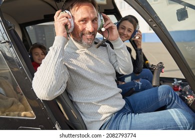 Excited Amateur Pilot Preparing To Fly A Helicopter