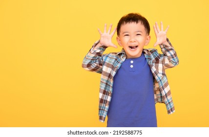 Excited Asian Boy  Gesturing Actively With Both Hands 