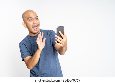 Excited Asian Man Waving Hand When Make Video Call