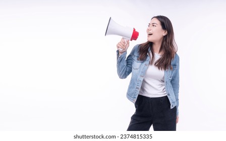Excited asian mixed race woman denim jacket use megaphone announcement hot news sale copy space on isolated white background. Happy young girl shouting speaker shock sale advertisement empty attention - Shutterstock ID 2374815335