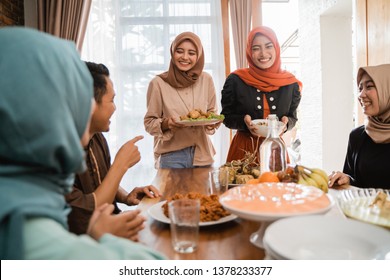 Excited Asian Muslim People Served With Food For Lunch During Eid Mubarak Celebration