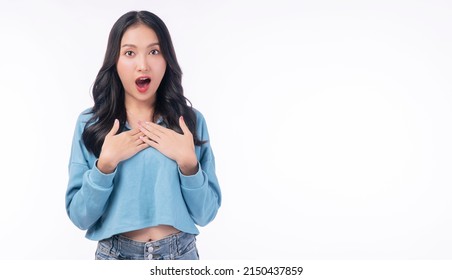 Excited asian woman casual holding hand shocked surprised sale product with copy space over white background. Cheerful young girl emotion amazed screaming wow something on isolated. Shopping  online.