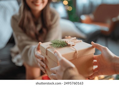 Excited asian woman getting surprise gift from her girlfriend at home. Gives a Christmas gift, birthday gift, New year day celebration and congratulation - Powered by Shutterstock