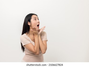 Excited Asian Woman Shout Out Loud Wow With Hands On Isolated White Background. Happy Shocked Face Female Wow Promotion Advertising Concept. Joyful Teenage Girl Standing In White Room.