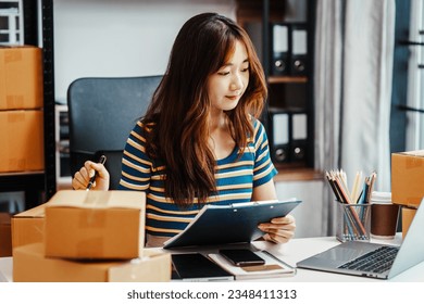 Excited Asians start small businesses, SME entrepreneurs, distribution warehouses with post boxes. owner's small home office, fresh graduate, social media influencers impact on society - Shutterstock ID 2348411313