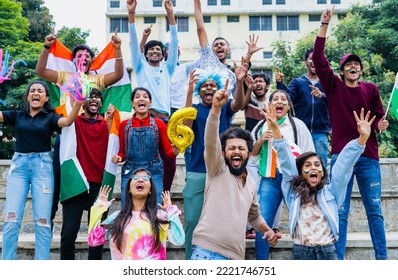 Excited Audience Celebrating Sixer By Shouting And Screaming By Showing Hand Gestures And Signs While Watching Cricket Match At Stadium - Concept Of Entertainment, Enjoyment And Joyful Spectators