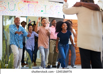 Excited Black Family Welcoming Guests At A Surprise House Party,close Up