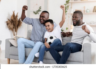 Excited Black Grandfather, Dad And Son Cheering Favorite Football Team At Home, Watching Sports On Tv In Living Room