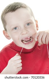 Excited Boy Flossing His Teeth