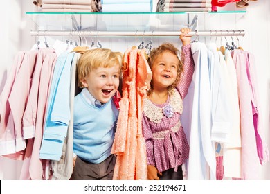 Excited Boy And Girl Play Hide-and-seek In Store