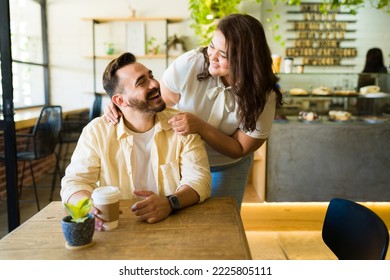 Excited Caucasian Man Getting A Surprise Visit From His Happy Plus Size Girlfriend While Having A Coffee Date 