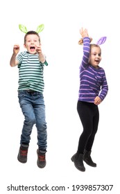 Excited Cheerful Jumping Kids Boy And Girl In Easter Bunny Ears Hat Action. Full Body Isolated On White Background