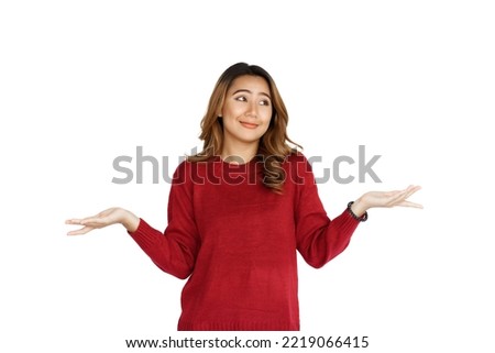 Excited confident asian happy woman in winter sweater red color isolated on white background. Don't care, don't worry