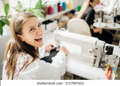 Excited Creative Tailor Working On Sewing Machine.Handmade Protective Cotton Masks Making.DIY Project,learning To Sew On Sewing Machine.Sewing Class.Craft Hobby.Happy Seamstress In Apparel Industry