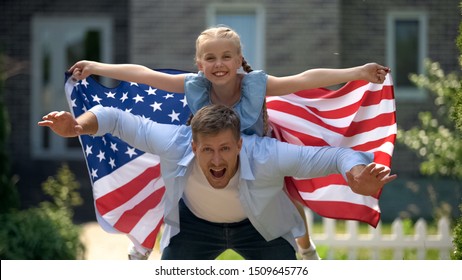 Excited Dad And Girl Patriots Having Fun, Holding USA Flag, Family Immigration