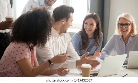 Excited Diverse Employees Sit Office Desk Stock Photo 1419432587 ...