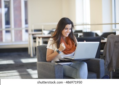 Excited Diverse Student Studying On Laptop In Library In College, High School. 