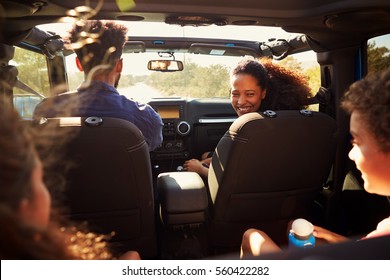 Excited Family On A Road Trip In Car, Rear Passenger POV