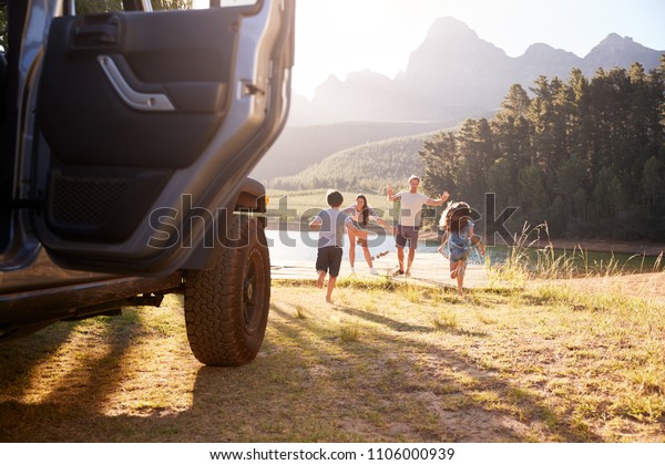 Excited Family Reaching Countryside Destination On\
Road Trip