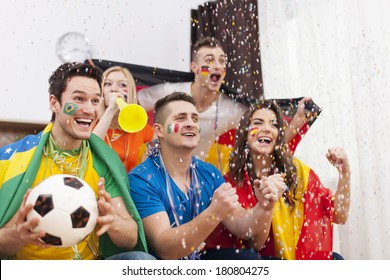 Excited fans of soccer celebrating winning match - Powered by Shutterstock