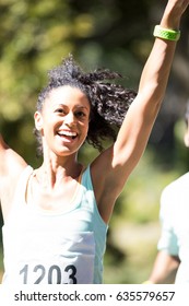 Excited Female Athlete Winning The Marathon Race