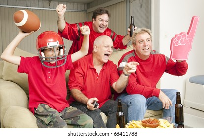 Excited Football Fans Watching Their Team Score A Touchdown.