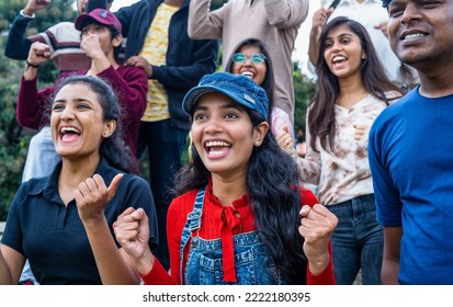 Excited Girl With Audience At Stadium Cheering By Celebrating Win By Shouting While Watching Live Cricket Sports Match - Concpet Of Happiness, Entertainment And Championship.