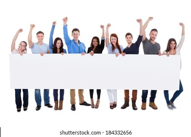 Excited group of diverse people holding banner. Isolated on white - Powered by Shutterstock