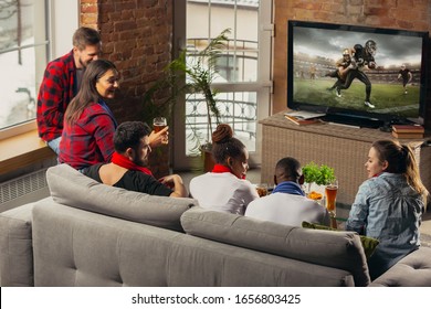 Excited Group Of People Watching American Football, Sport Match At Home. Multiethnic Group Of Emotional Friend, Fans Cheering For Favourite National Team, Drinking Beer. Concept Of Emotions, Support.