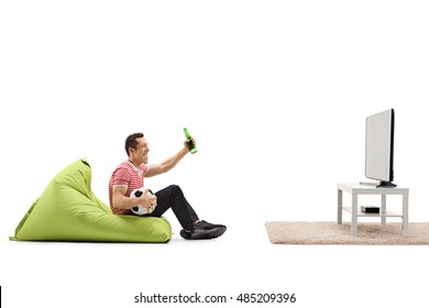 Excited Guy Sitting On A Beanbag Watching Football On Tv And Having A Beer Isolated On White Background