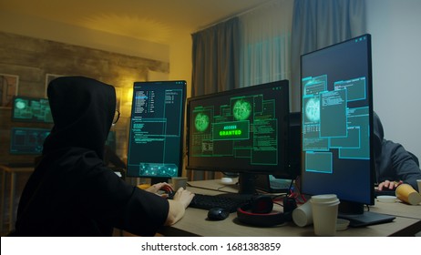 Excited hacker girl after gets access granted on cyber attack. Dangerous internet criminals. - Shutterstock ID 1681383859
