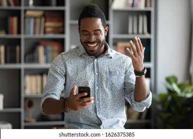 Excited Happy African Business Man Professional Winner Celebrate Success Read Good News On Smart Phone Feel Overjoyed With Mobile Message Online Bet Bid App Game Win Looking At Cellphone In Office