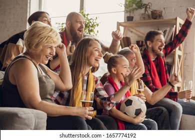 Excited, Happy Big Family Watching Football, Soccer Match On The Couch At Home. Fans Emotional Cheering For Favourite National Team. Having Fun From Grandparent To Children. Sport, TV, Championship.