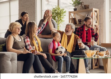 Excited, Happy Big Family Watching Football, Soccer Match On The Couch At Home. Fans Emotional Cheering For Favourite National Team. Having Fun From Grandparent To Children. Sport, TV, Championship.