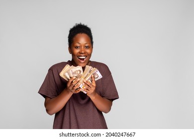 Excited And Happy Young African Woman Holding A Lot Of Cash