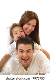 Excited, Happy Young Family In A Joyful Huddle