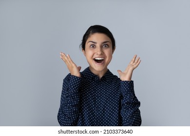Excited happy young Indian woman expressing shock, surprise, amazement, euphoric emotions with hands gestures, face expression. Customer feeling joy about sale. Isolated head shot portrait