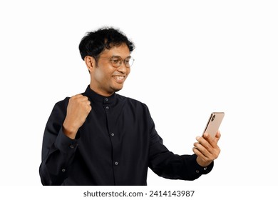 Excited happy young man winner feeling joy using smartphone winning lottery game, betting, stock market, getting online gift in mobile app message holding cell phone isolated on white background. - Powered by Shutterstock