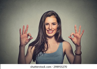 Excited Happy Young Optimistic Woman Giving Ok Sign Gesture With Two Hands Isolated On Gray Wall Background. Positive Human Emotions Face Expression Body Language 