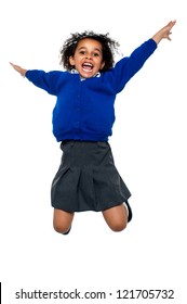 Excited Jubilant School Kid Jumping High Up In The Air After Hearing Her Annual Result.