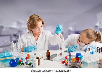 Excited Kid conducting a scientific experiment  or chemical reaction at chemistry laboratory - Powered by Shutterstock