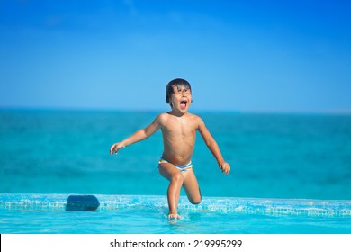 Excited Kid In Slow Motion Of Jumping Into  Water