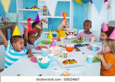 Excited Kids Enjoying A Birthday Party Together